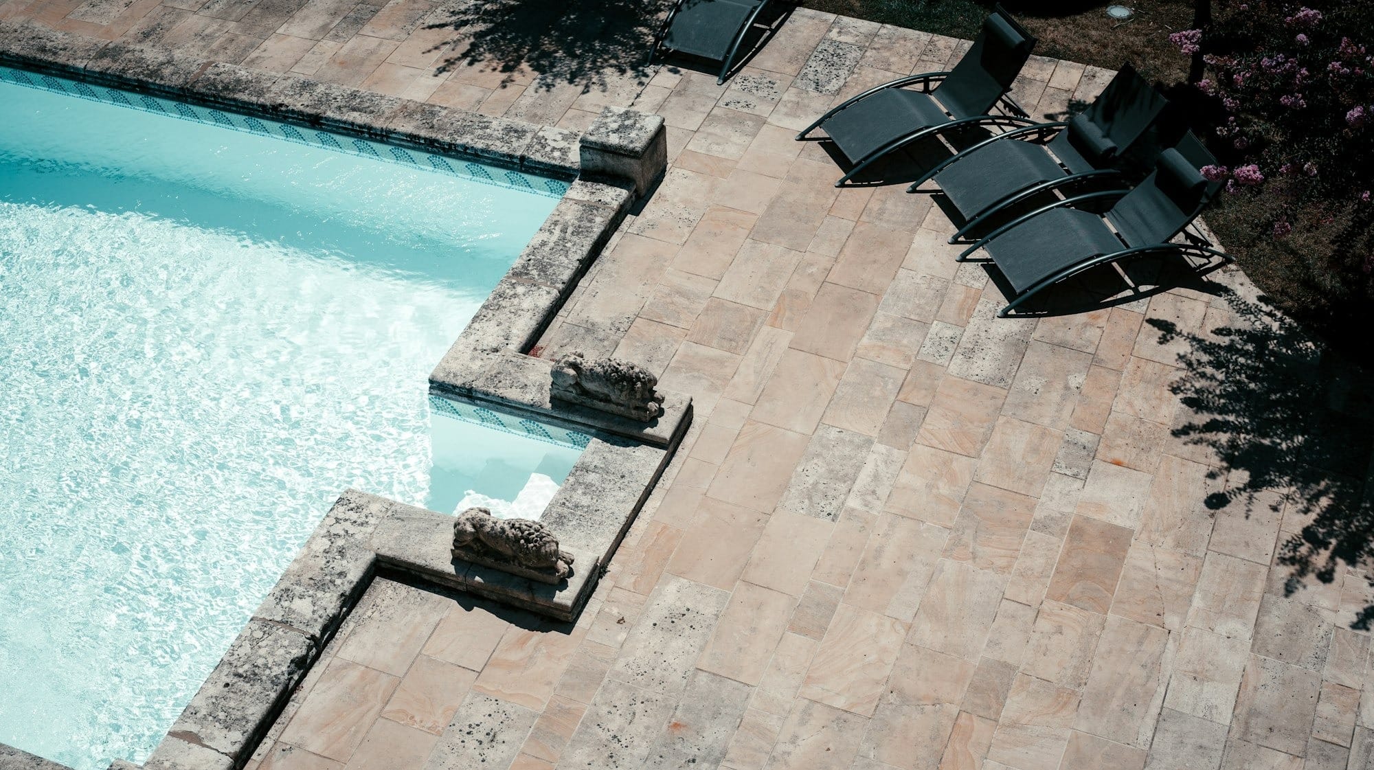 a pool with chairs around it