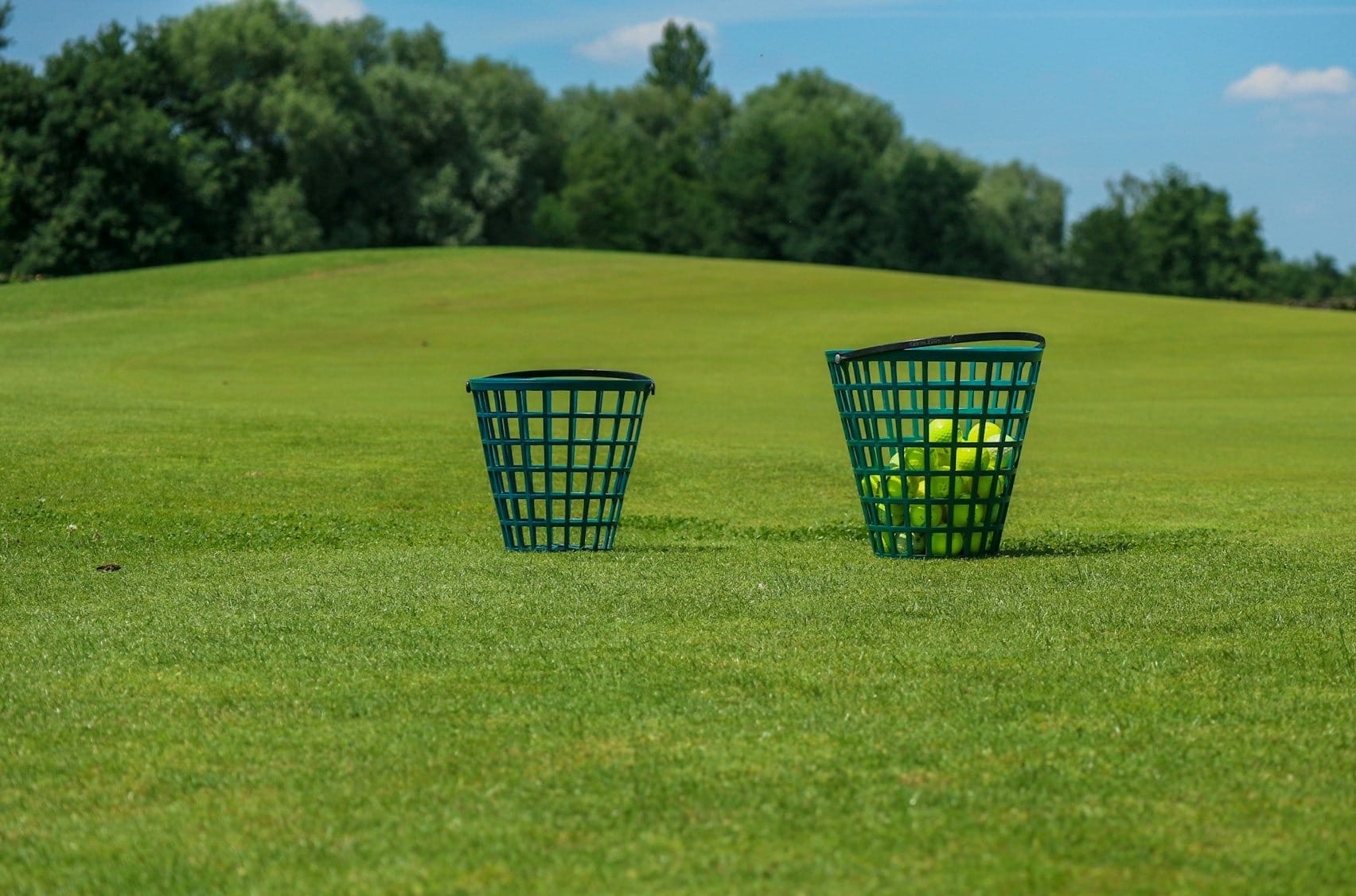 a couple of baskets on a grass field