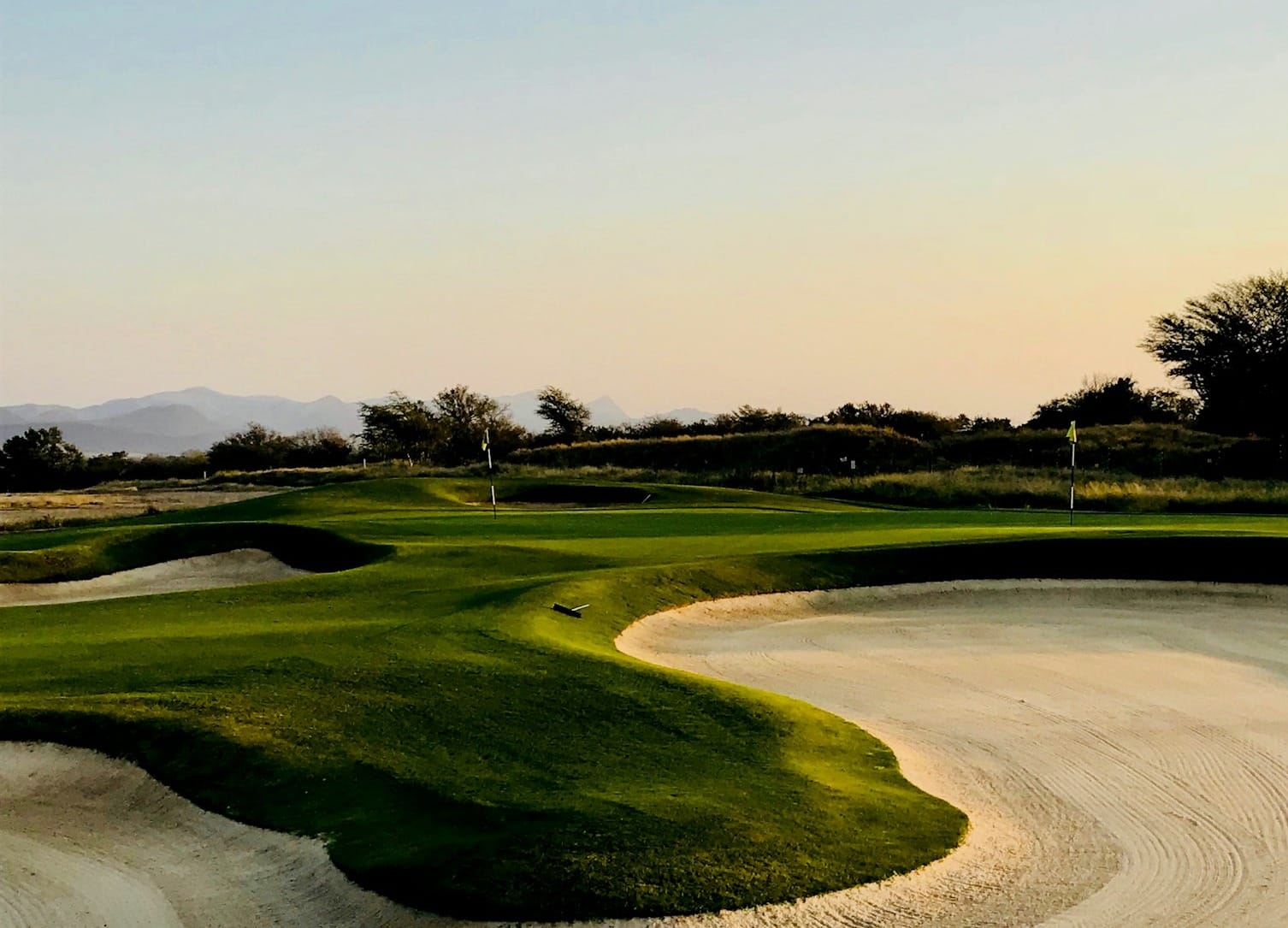 golf field under clear blue sky